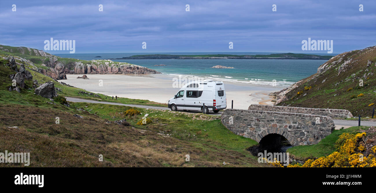 Motorhome driving on desolate road past Ceannabeinne Beach in summer near Durness, Sutherland, Scottish Highlands, Scotland Stock Photo