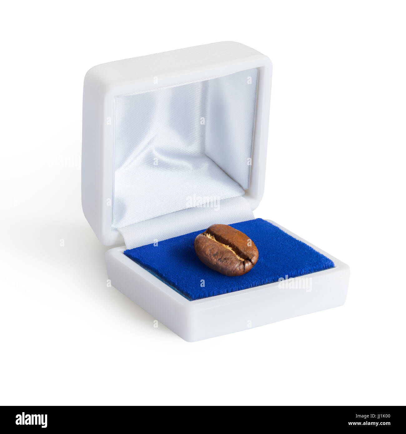 Creative concept photo of a jewelry box with a coffee bean on white background. Stock Photo
