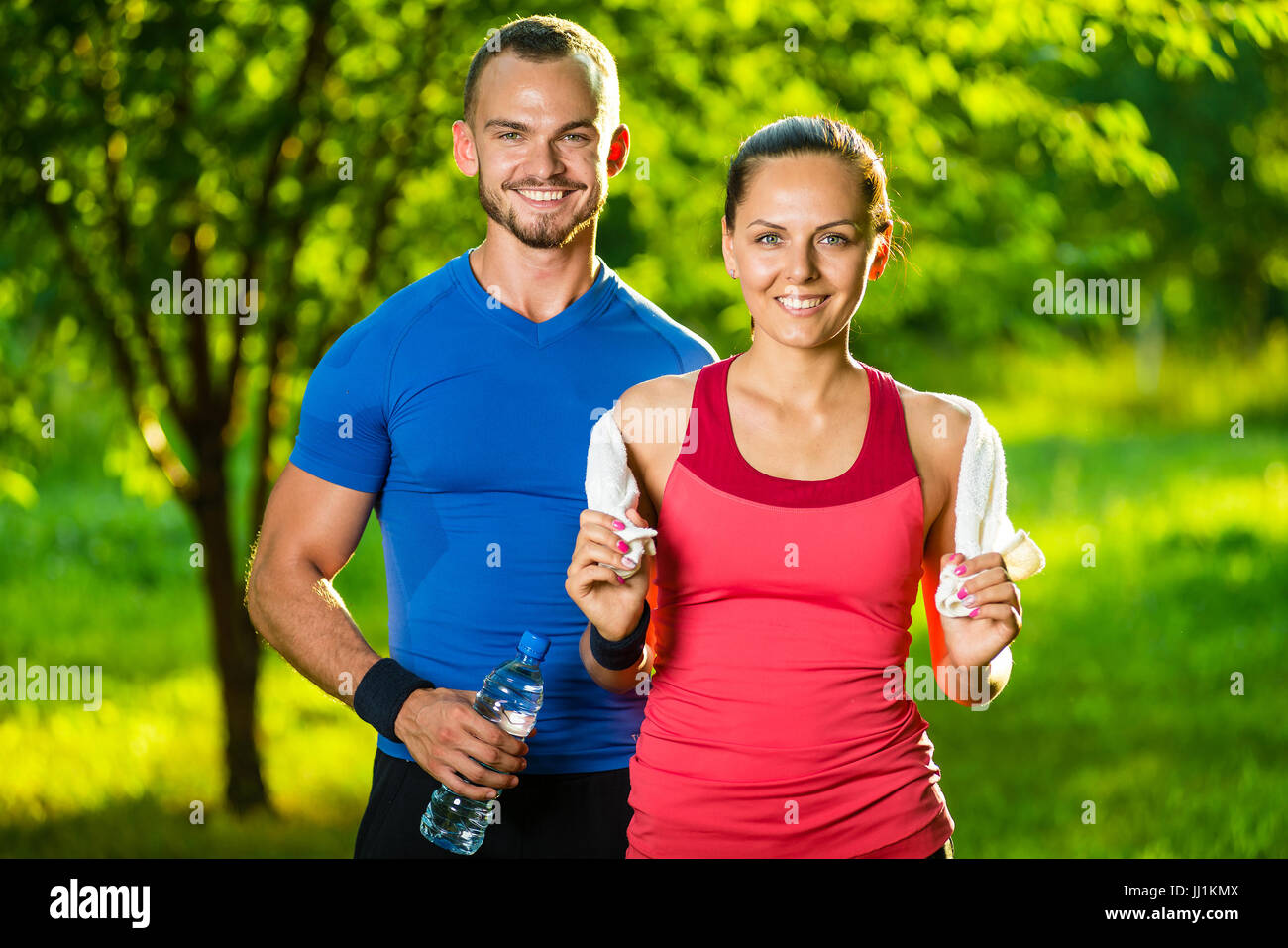 Athletic man and woman after fitness exercise Stock Photo