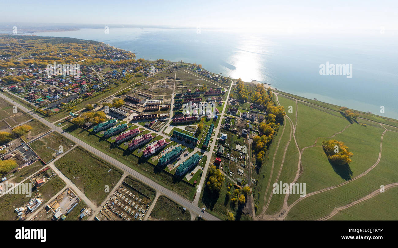Aerial view of a summer house village at blue sea coast. Stock Photo