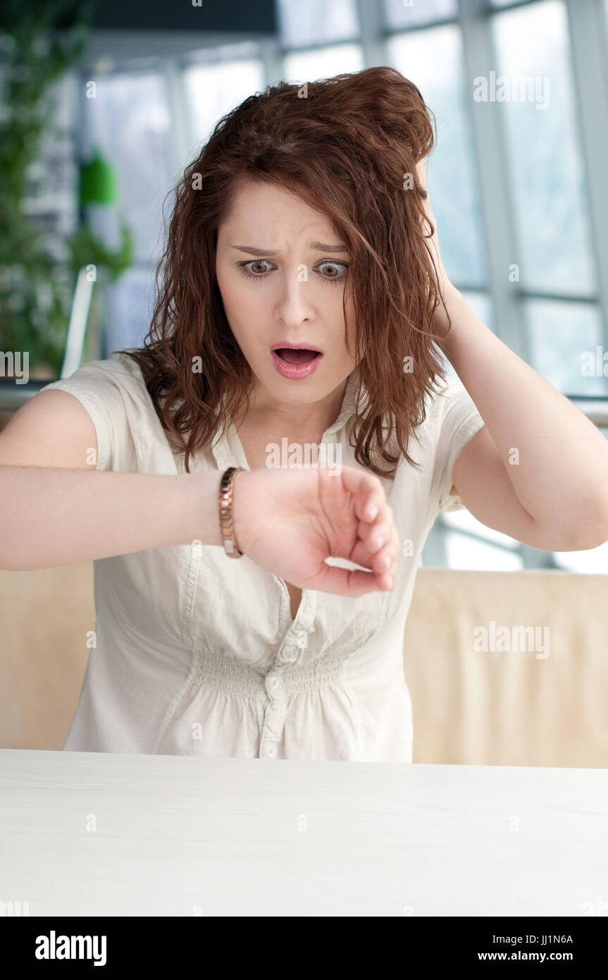 Business woman with watch at office Stock Photo Alamy