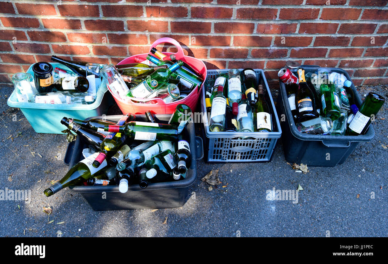 Glass bottles placed in recycling box outside property for collection