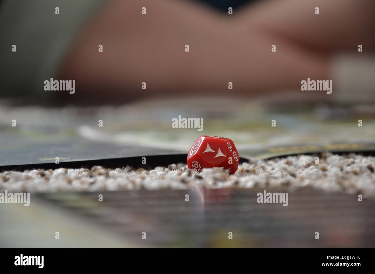 A red rolled dice while playing a star wars role playing game (RPG). Stock Photo