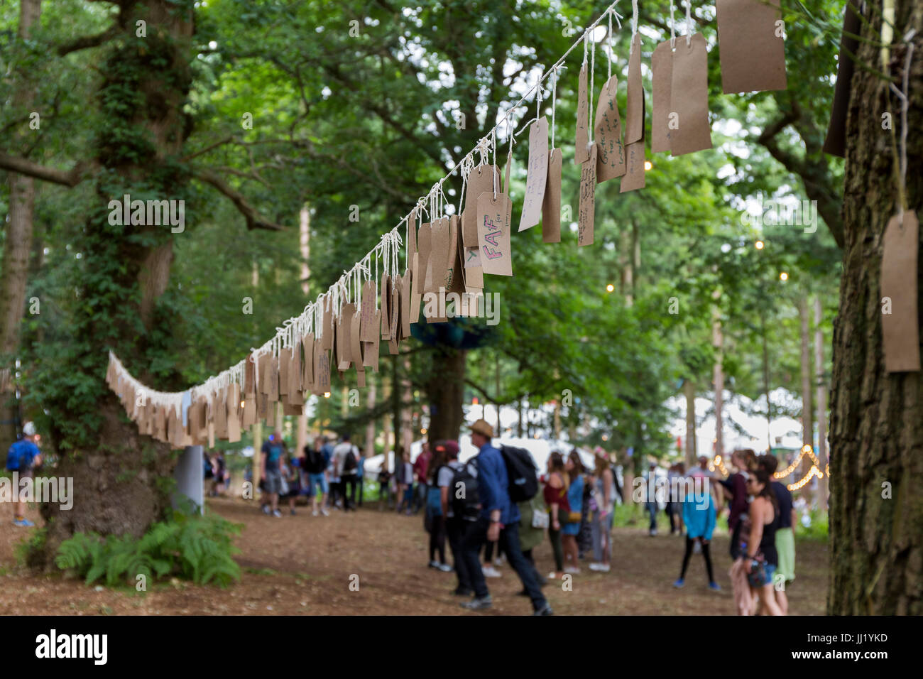 String of brown parcel tags written by festival-goers including one which says 'FAF'. Faraway Forest, Latitude Festival, Suffolk Stock Photo