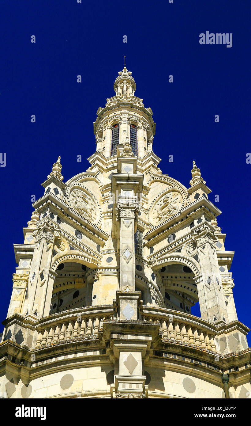 Chateau de Chambord, Loire Valley, France - close up of central ornate domed spire in portrait format against an intense blue sky. Stock Photo