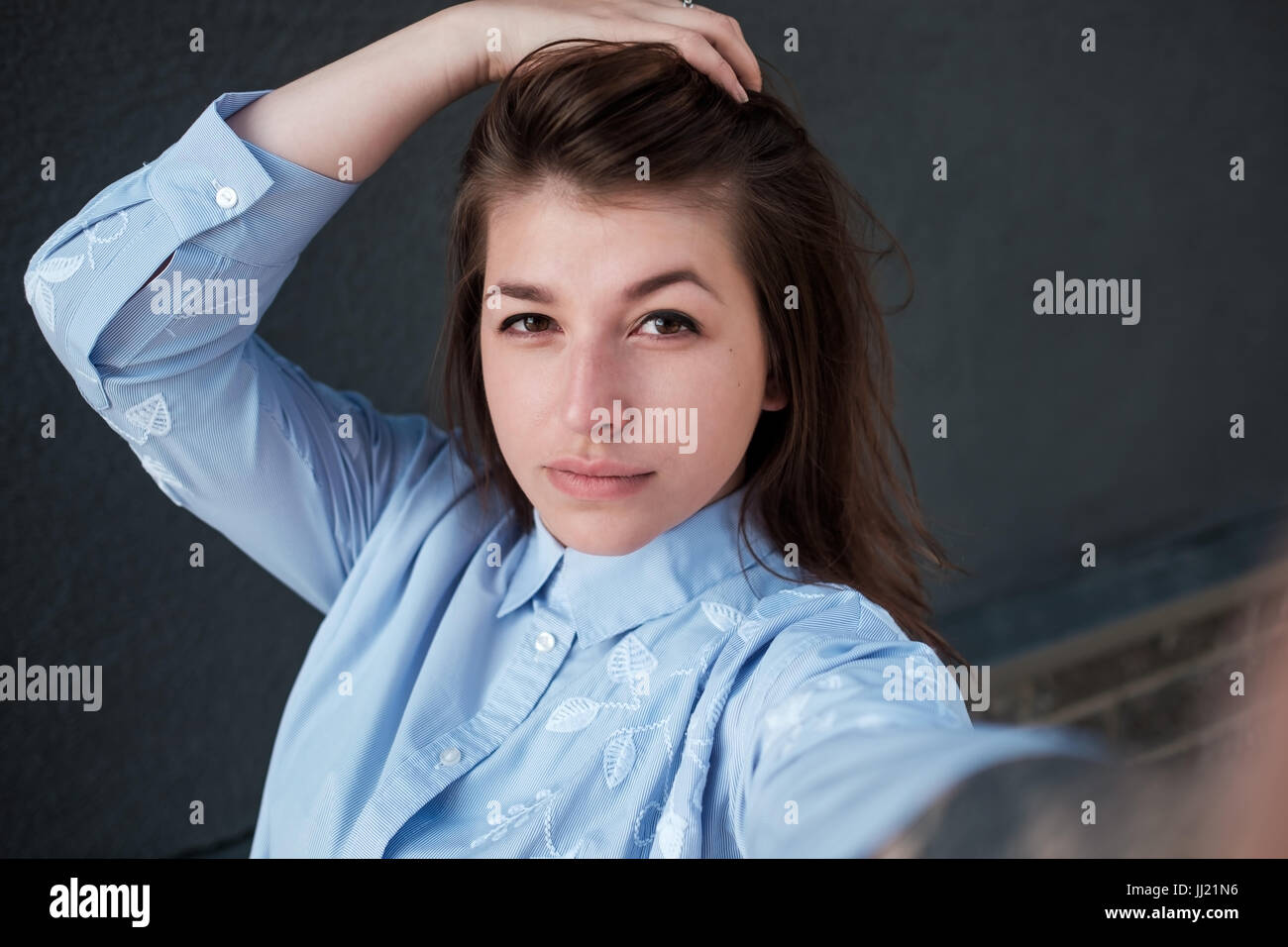 Girl makes selfie photo. Close up portrait, view of the camera Stock Photo
