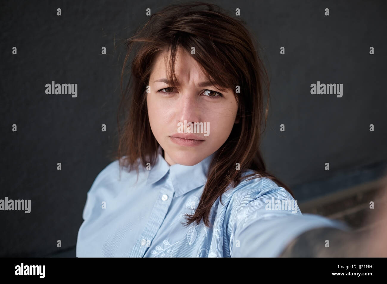 Girl makes selfie photo. Close up portrait, view of the camera Stock Photo