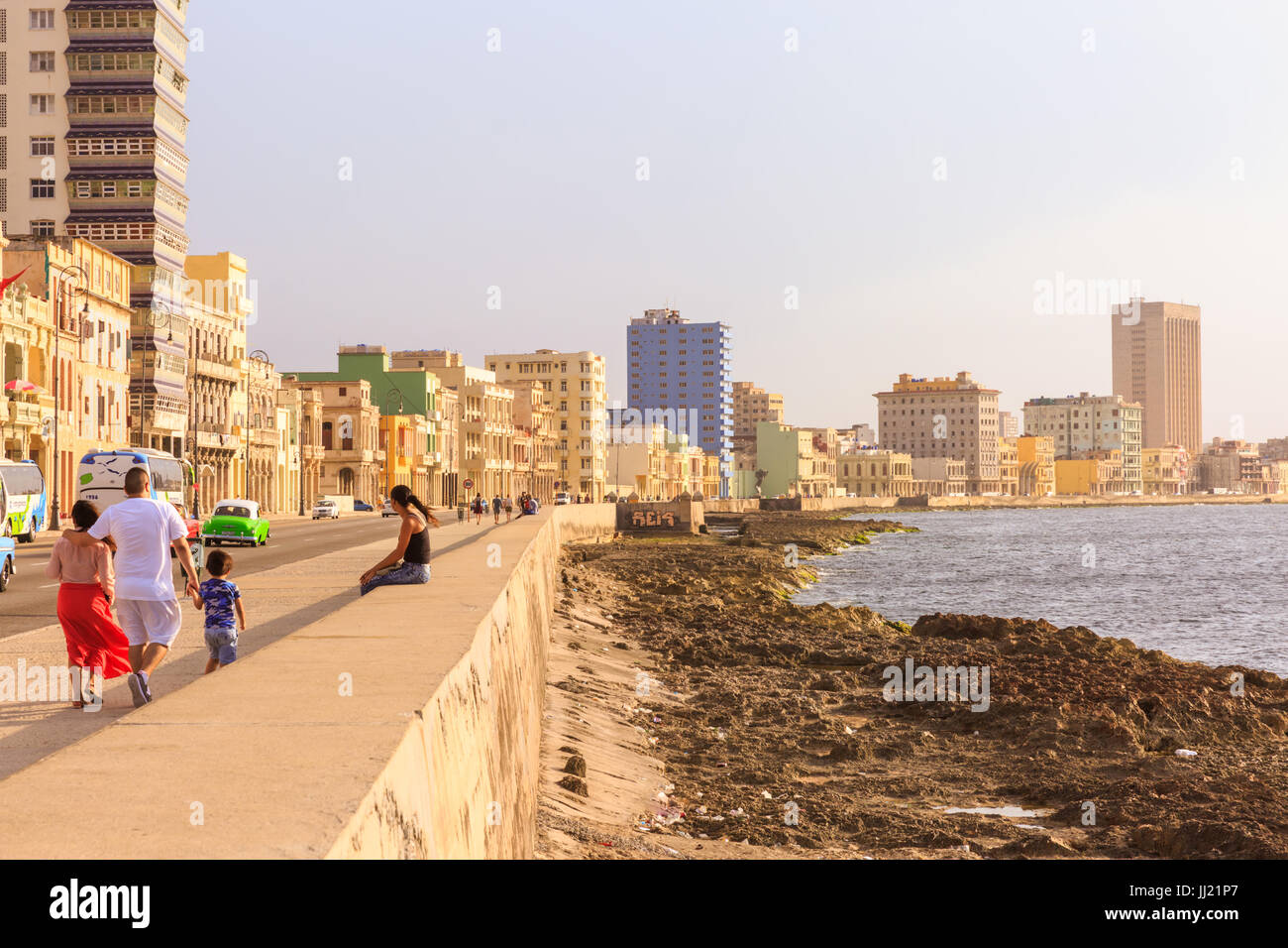 People walking on the Malecon seafront promenade, Havana, Cuba Stock Photo