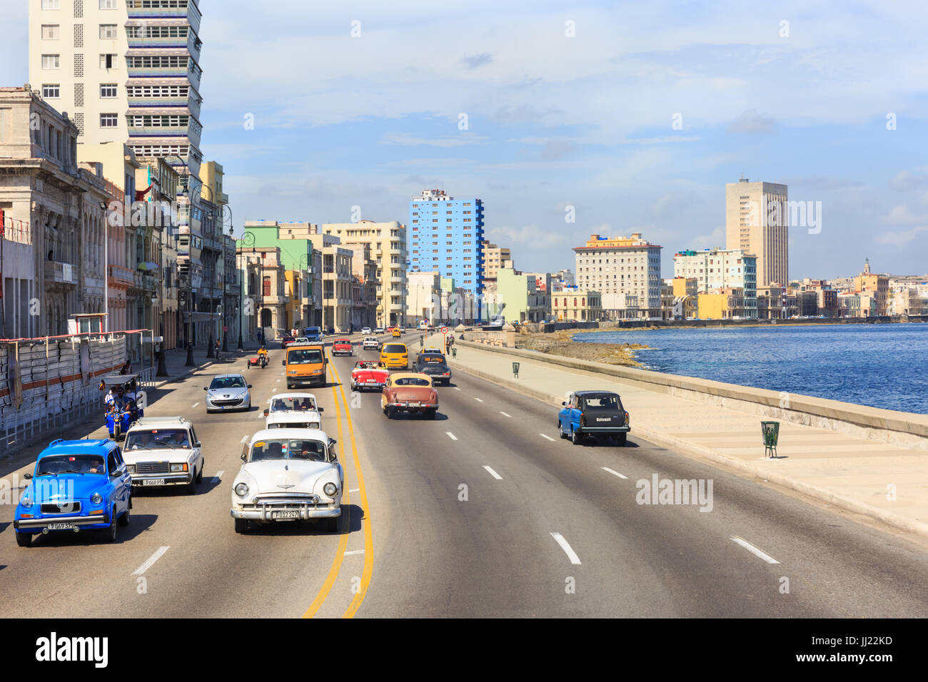 Classic cars and general traffic on the Malecon seafront avenue in Havana, Cuba Stock Photo