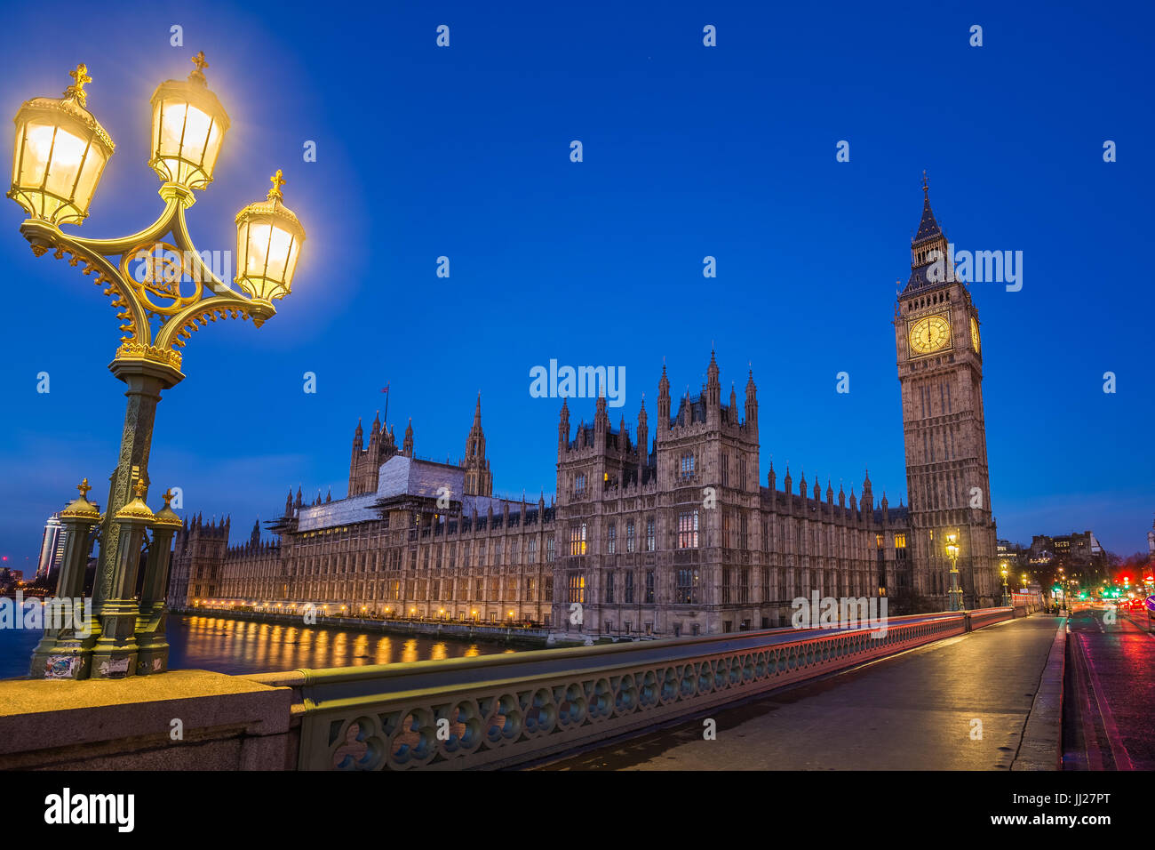 London, England - The Big Ben and the Houses of Parliament with street lamp taken from westminster bridge at dusk Stock Photo