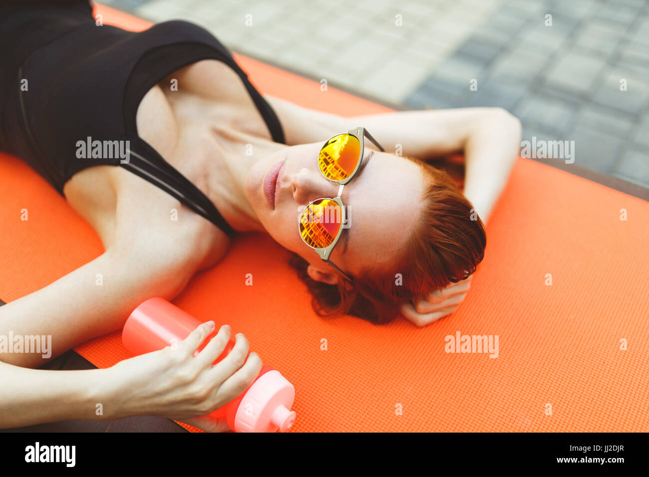 Woman lies on sports hi-res stock photography and images - Alamy