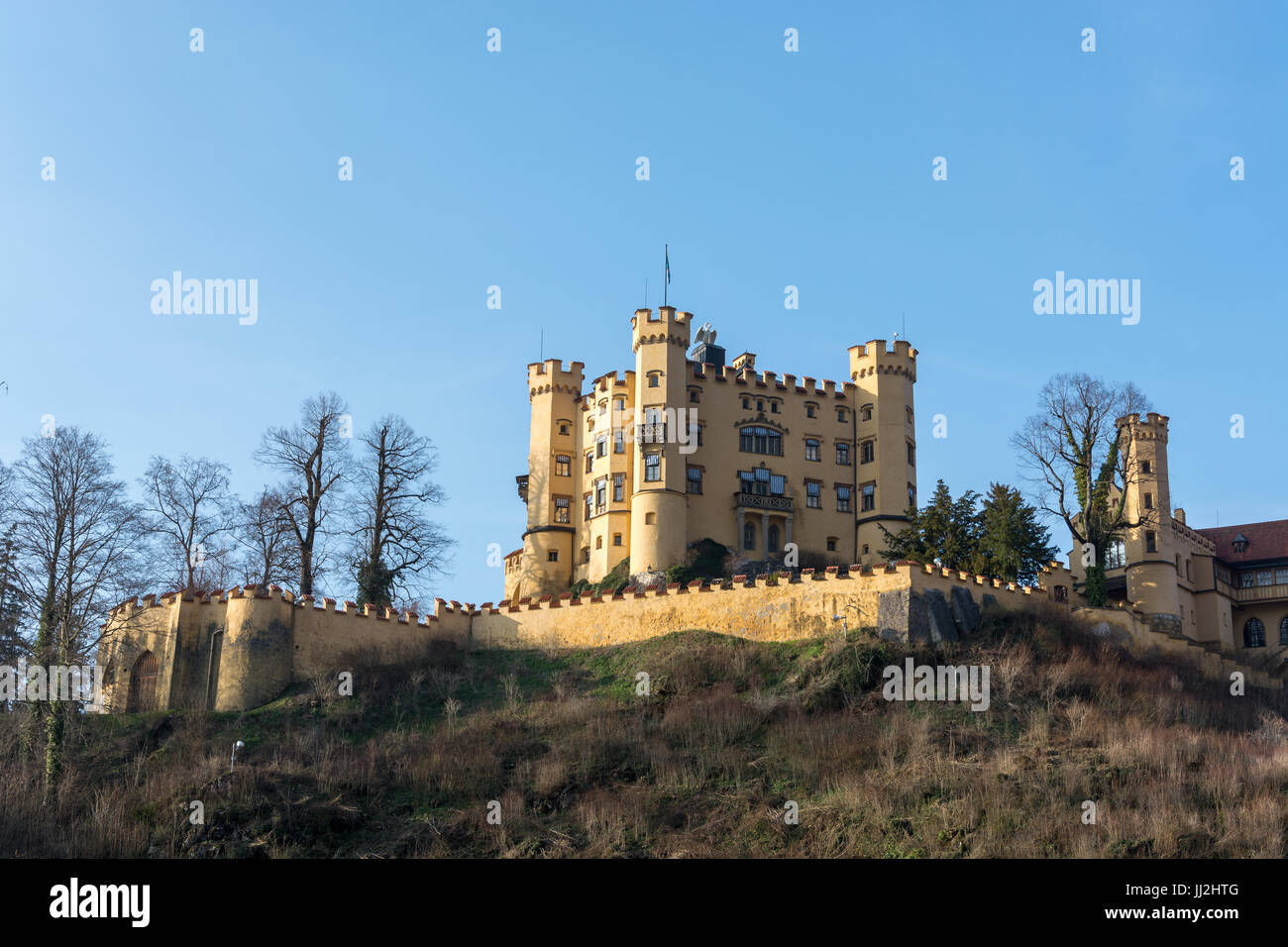 The castle Hohenschwangau on a hill in the sunny afternoon Stock Photo