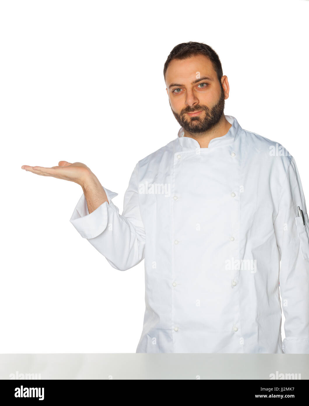 Young chef in white uniform without hat isolated on white background. Stock Photo