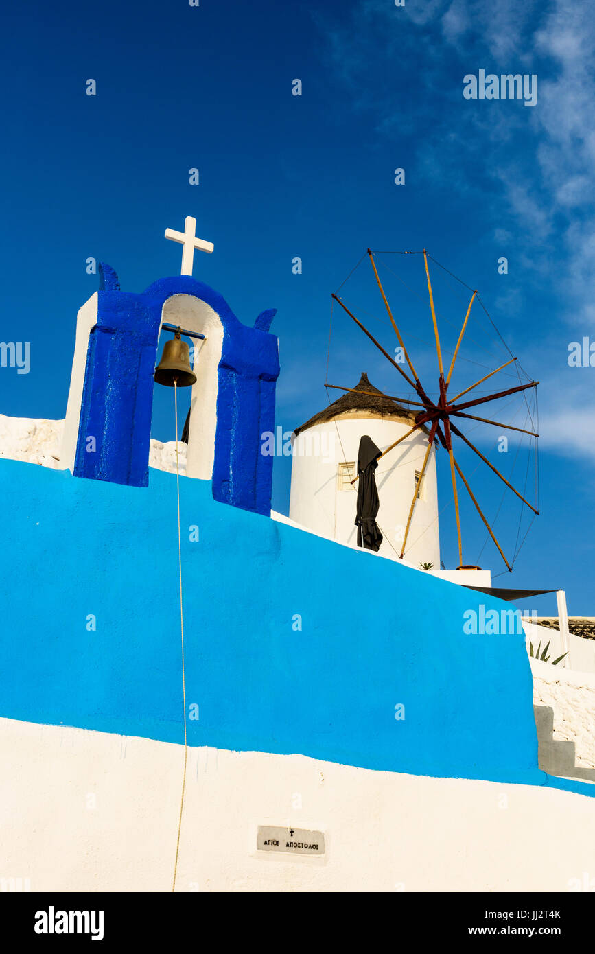 Typical white and blue belfry and windmill, Oia, Santorini, South Aegean, Greece Stock Photo