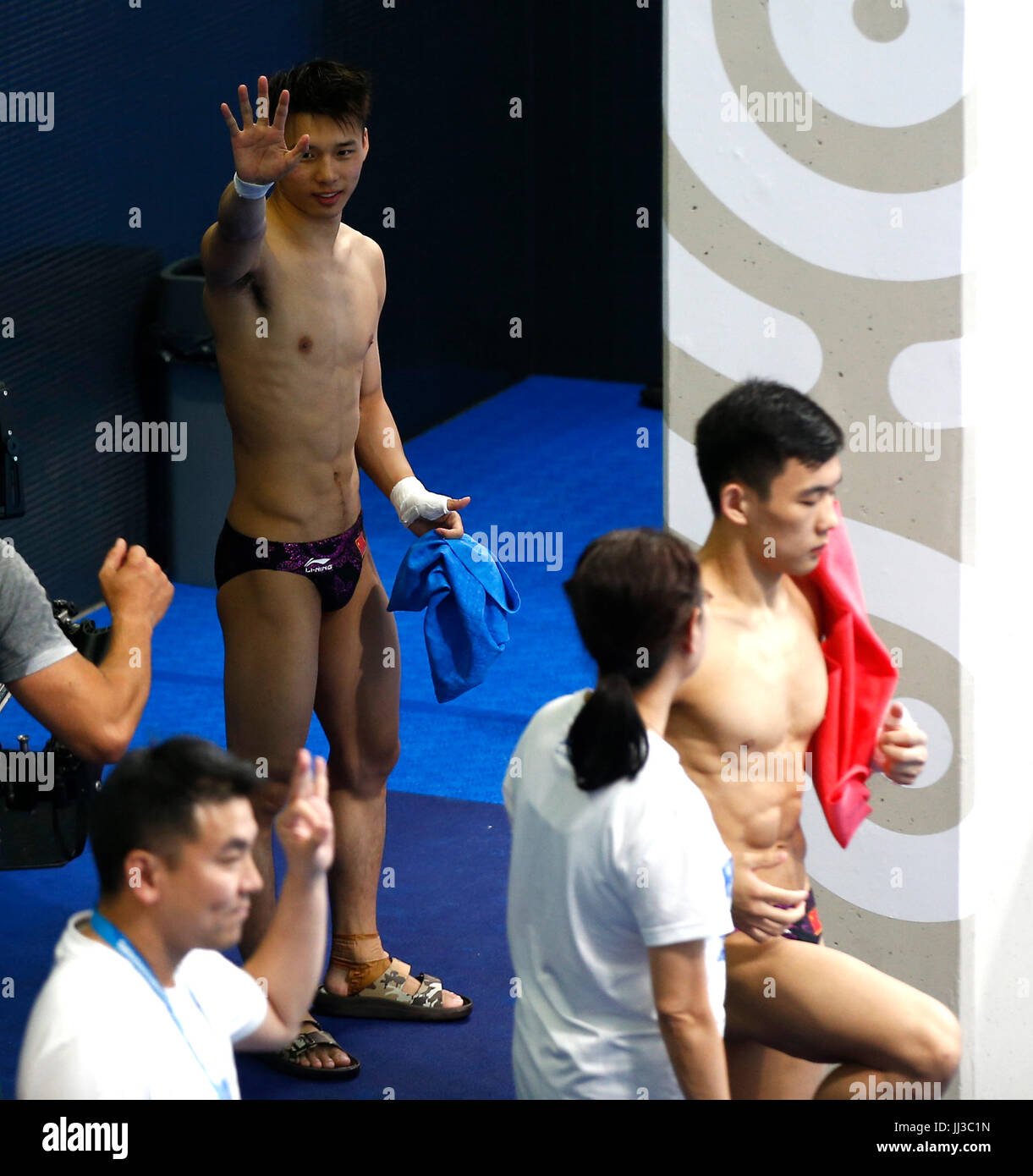 Budapest, Hungary. 17th July, 2017. China's Chen Aisen (top) reacts during the men's 10m platform synchronised final of Diving at the 17th FINA World Championships at Duna Arena in Budapest, Hungary, on July 17, 2017. The Chinese pair won the gold medals with 498.48 points. Credit: Ding Xu/Xinhua/Alamy Live News Stock Photo