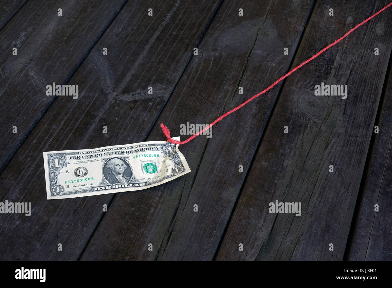 Berlin, Germany. 23rd Mar, 2017. ILLUSTRATION A onedollar bill is