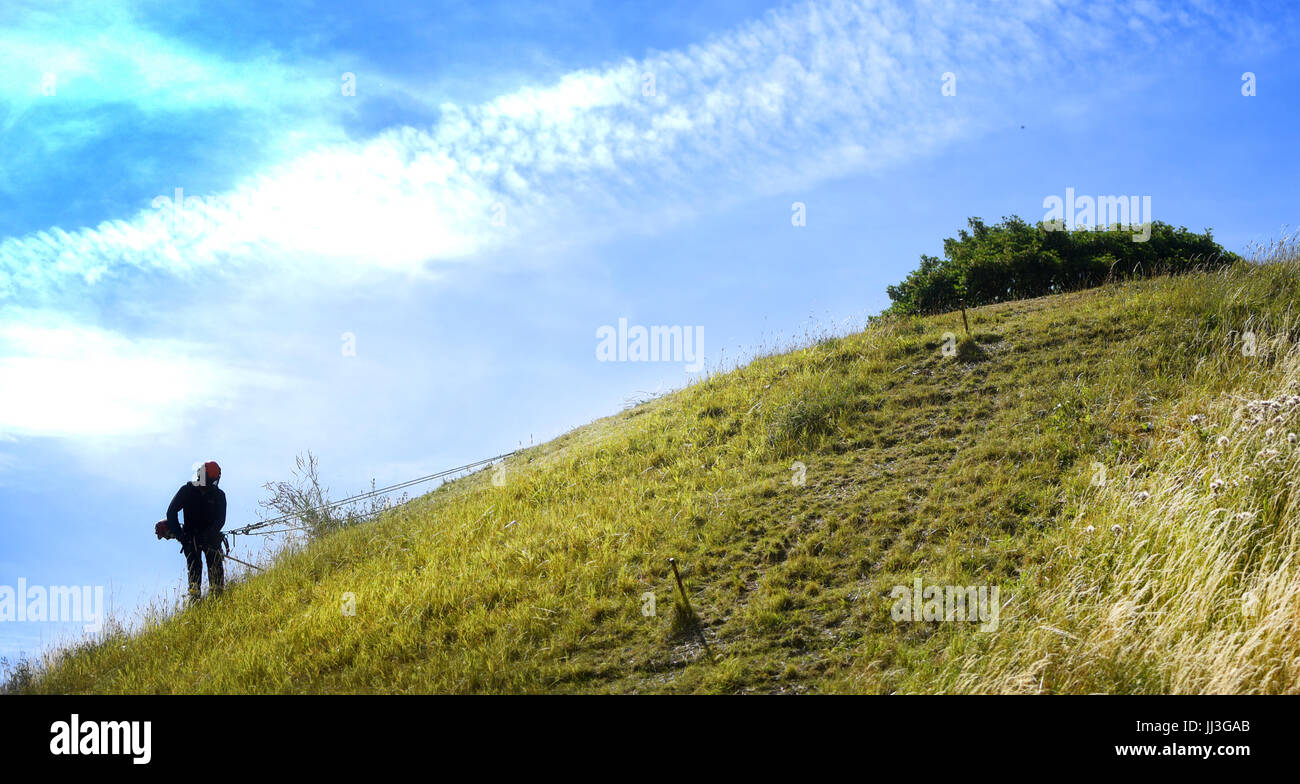 Oxford Castle, Oxford, UK. 18th July, 2017. Uphill struggle- cutting the grass on the ancient Castle Mound at Oxford Castle, Oxford. Picture by Richard Cave Photography 18.07.17 Credit: Richard Cave/Alamy Live News Stock Photo