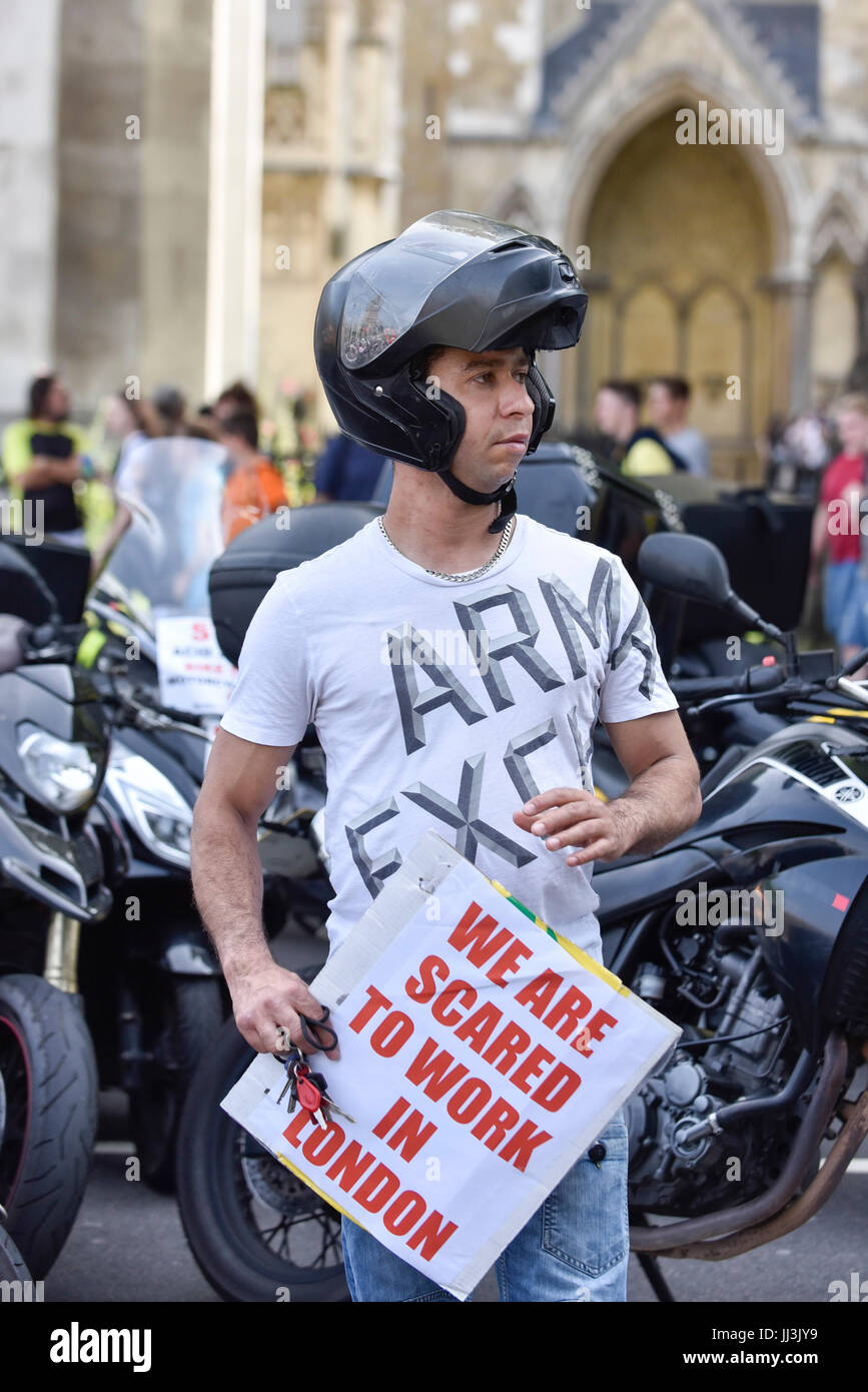 London, UK. 18th July, 2017. Moped riders stage a protest in Parliament Square demanding that the government act on moped thefts in the light of recent acid attacks by assailants riding stolen mopeds. Many of the protesters work for fast food delivery companies such as UBER and Deliveroo. Credit: Stephen Chung/Alamy Live News Stock Photo