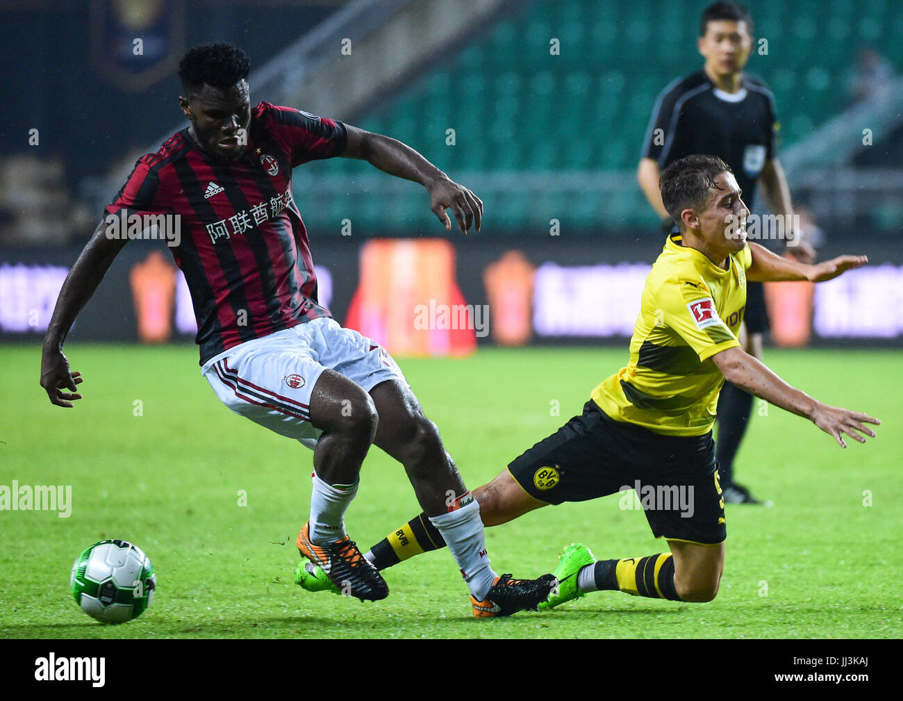 Guangzhou, China. 18th Jul, 2017. Cristian Zapata (L) of AC Milan vies with Emre Mor of Borussia Dortmund during the 2017 International Champions Cup (ICC) China soccer match at Guangzhou University Town Sports Center Stadium in Guangzhou, capital of south China's Guangdong Province, on July 18, 2017. AC Milan lost 1-3. Credit: Xinhua/Alamy Live News Stock Photo