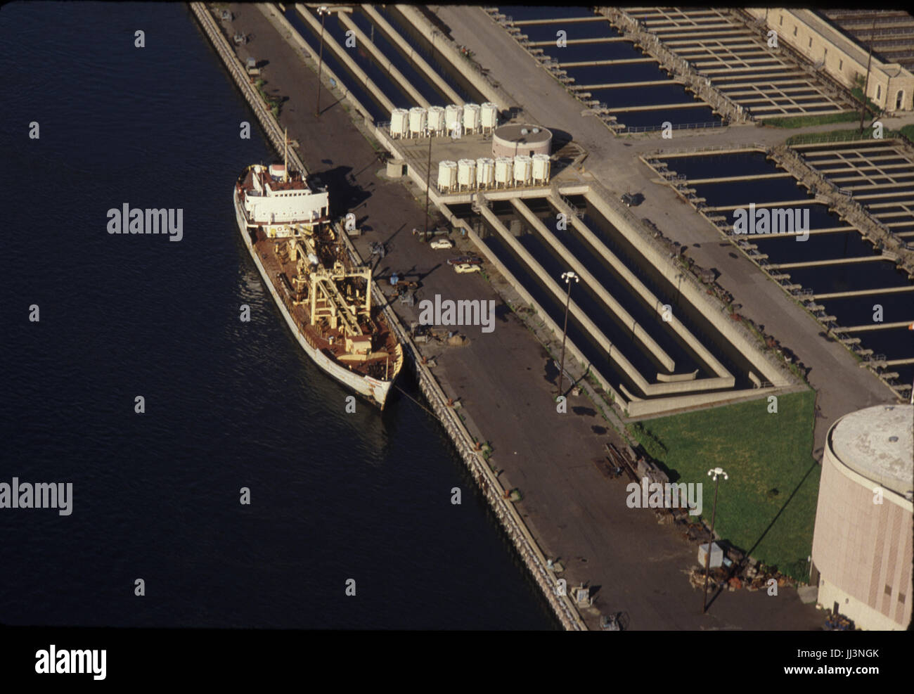 Look down view of oil tanker docked, East River, New York USA Stock Photo