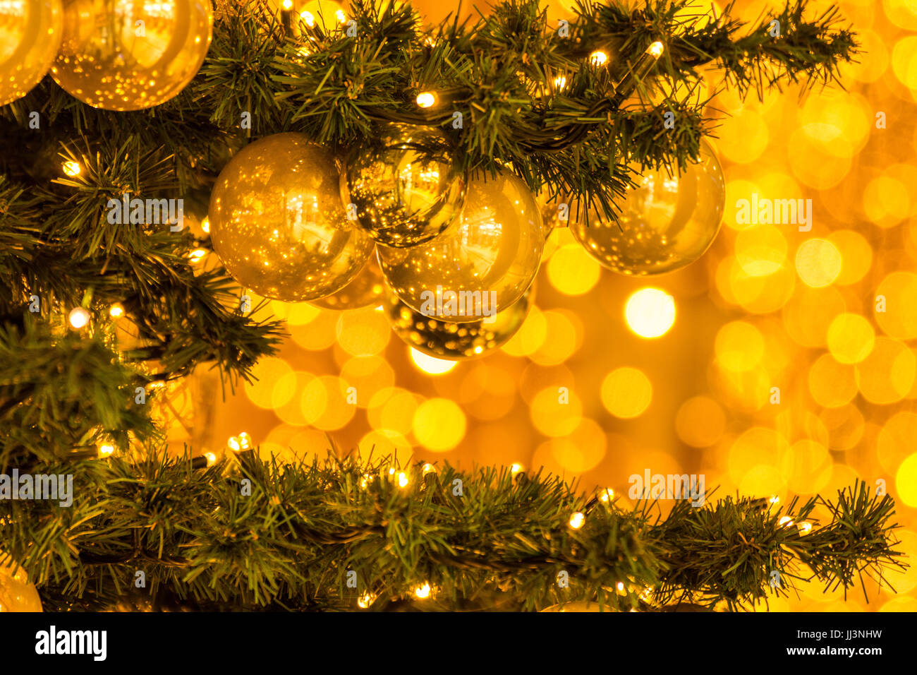 New Year Eve mood on golden bokeh background Stock Photo - Alamy