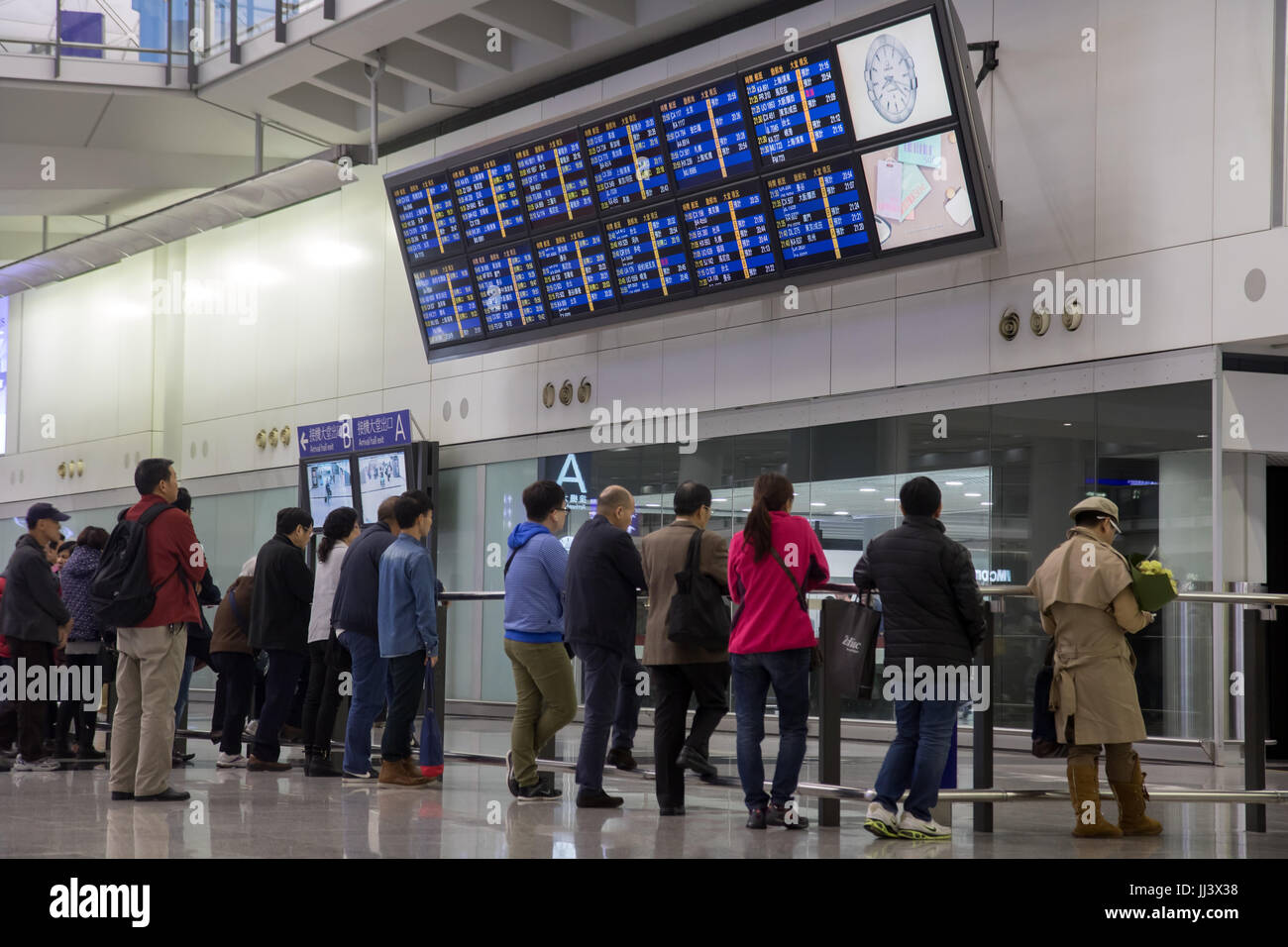 HONG KONG, 08 DEC 2015, Traffic at airport terminal. People wait under