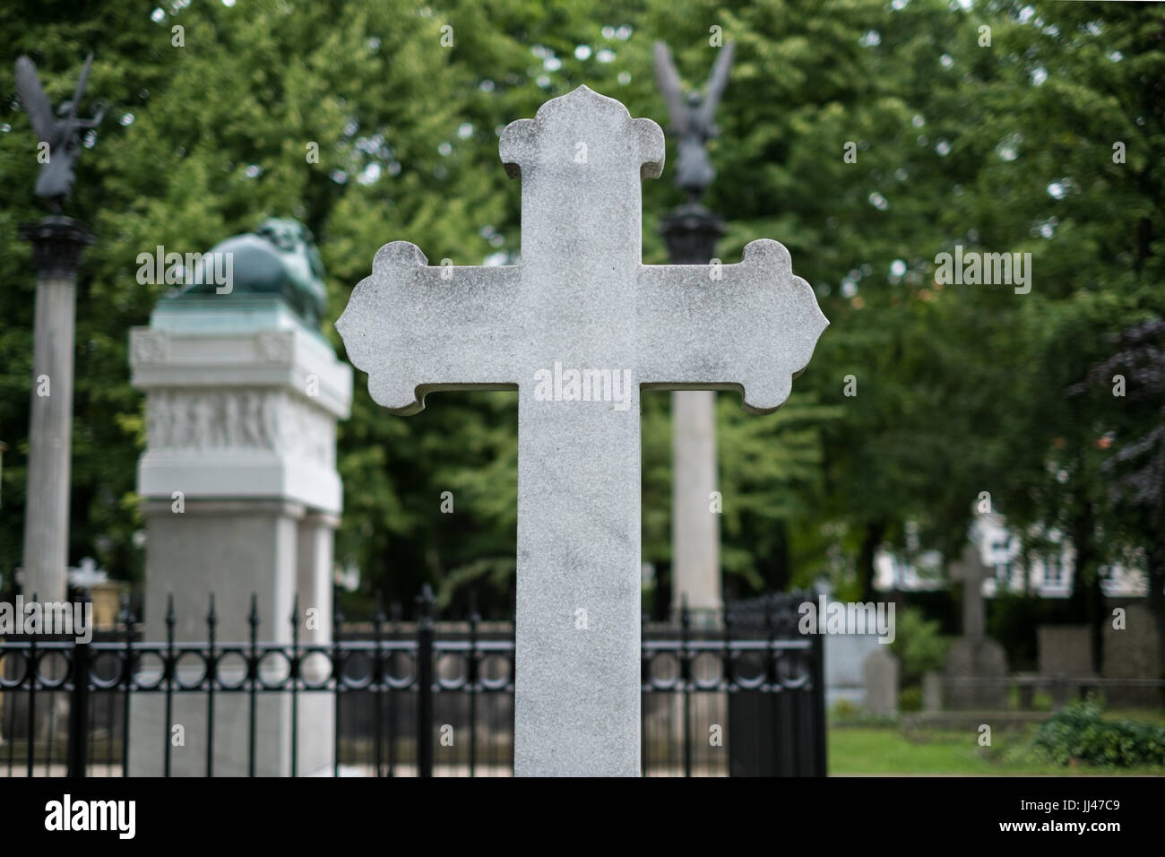 Stone cross gravestones on cemetery / graveyard Stock Photo