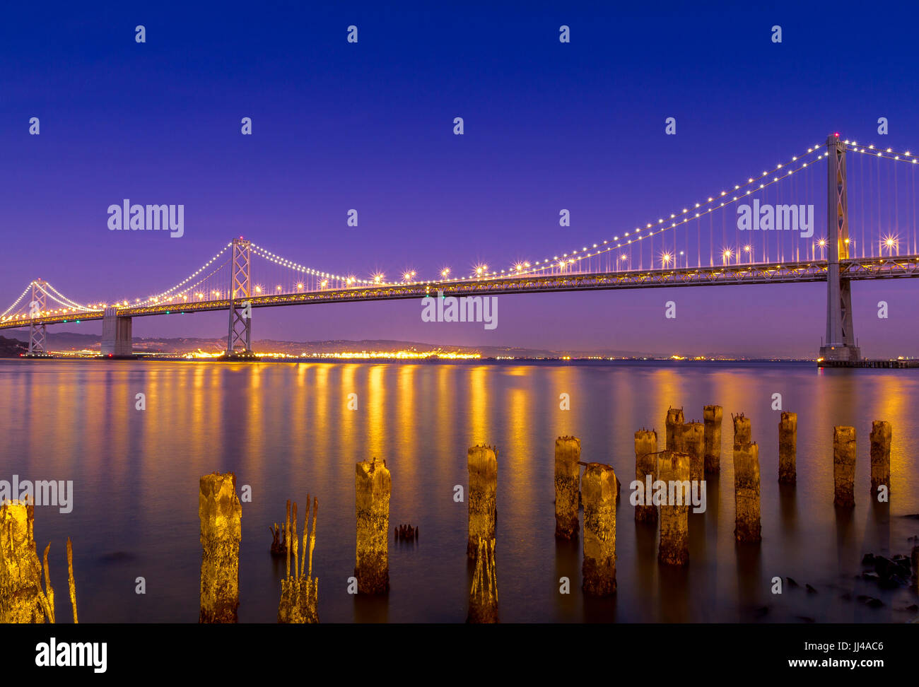 The Oakland Bay Bridge at night. The bridge connects Oakland to San Francisco , San Francisco ,California,USA Stock Photo