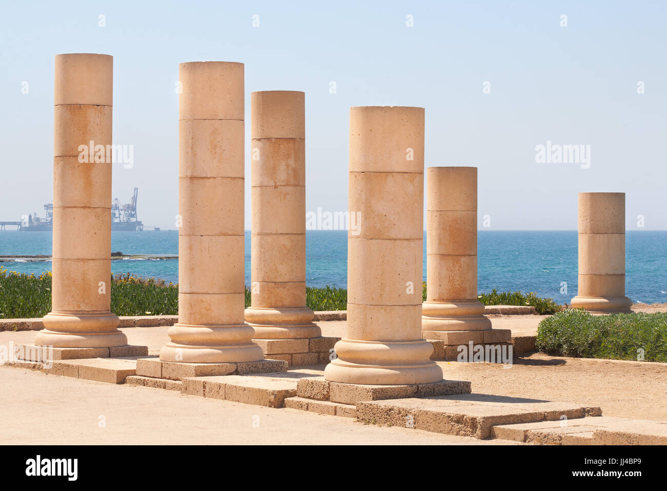 Roman old stone decorated column row in caesarea Archaeological site close to Herod the Great hippodrome Stock Photo