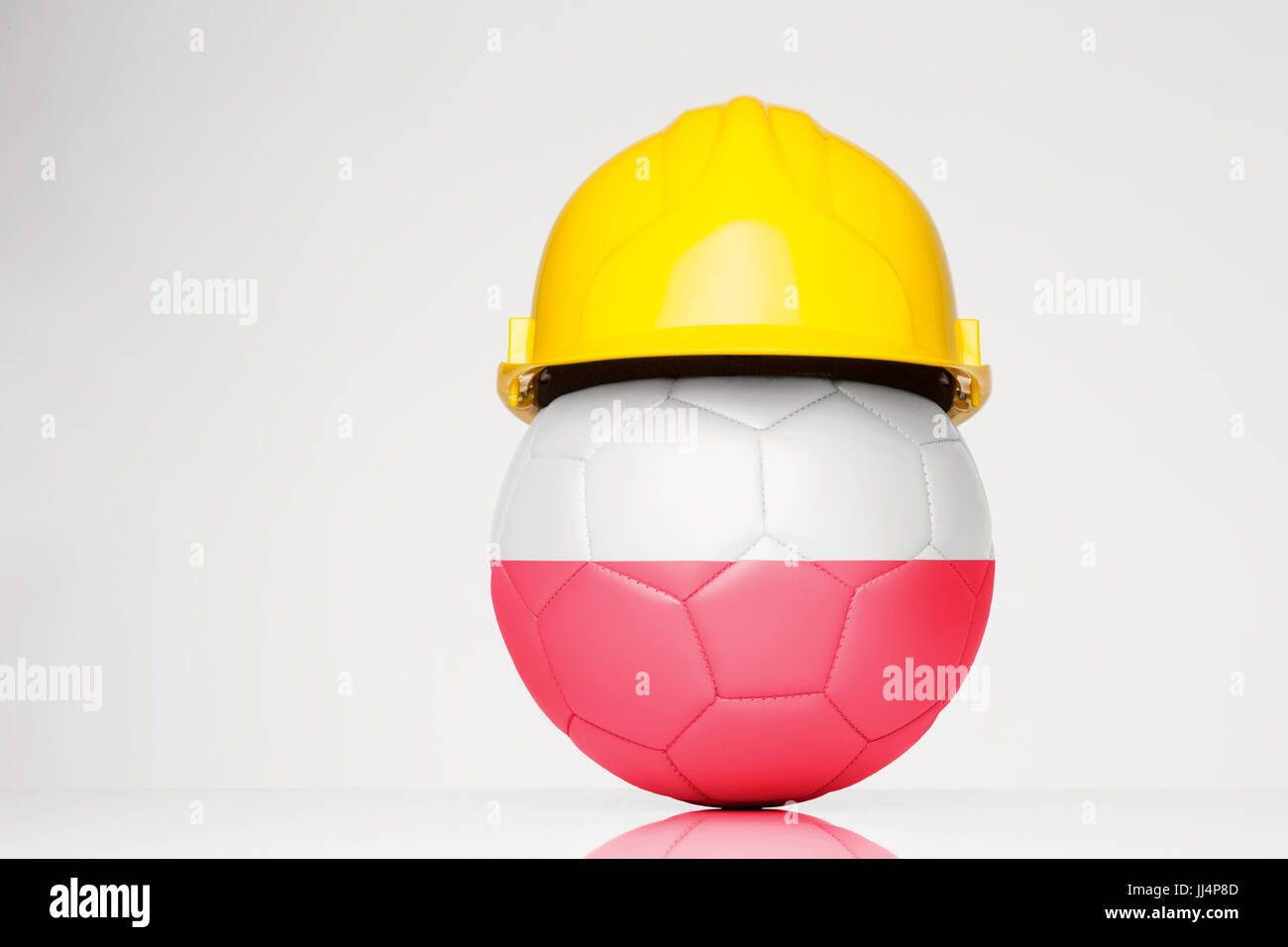 Football wearing a hard hat with the Poland flag superimposed on the