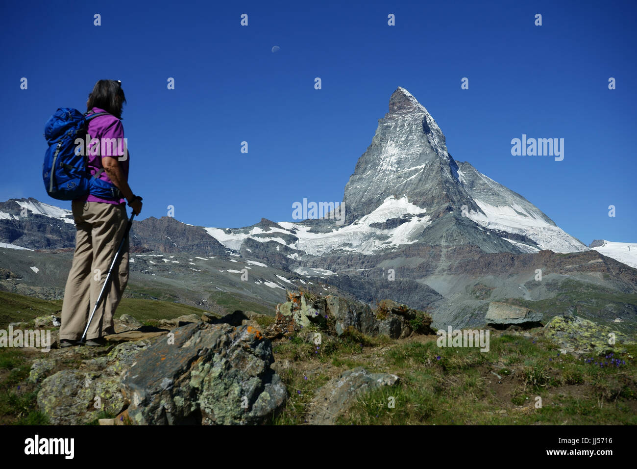 Hiker at Riffelberg with Matterhorn, Zermatt, Swiss alps, Switzerland Stock Photo