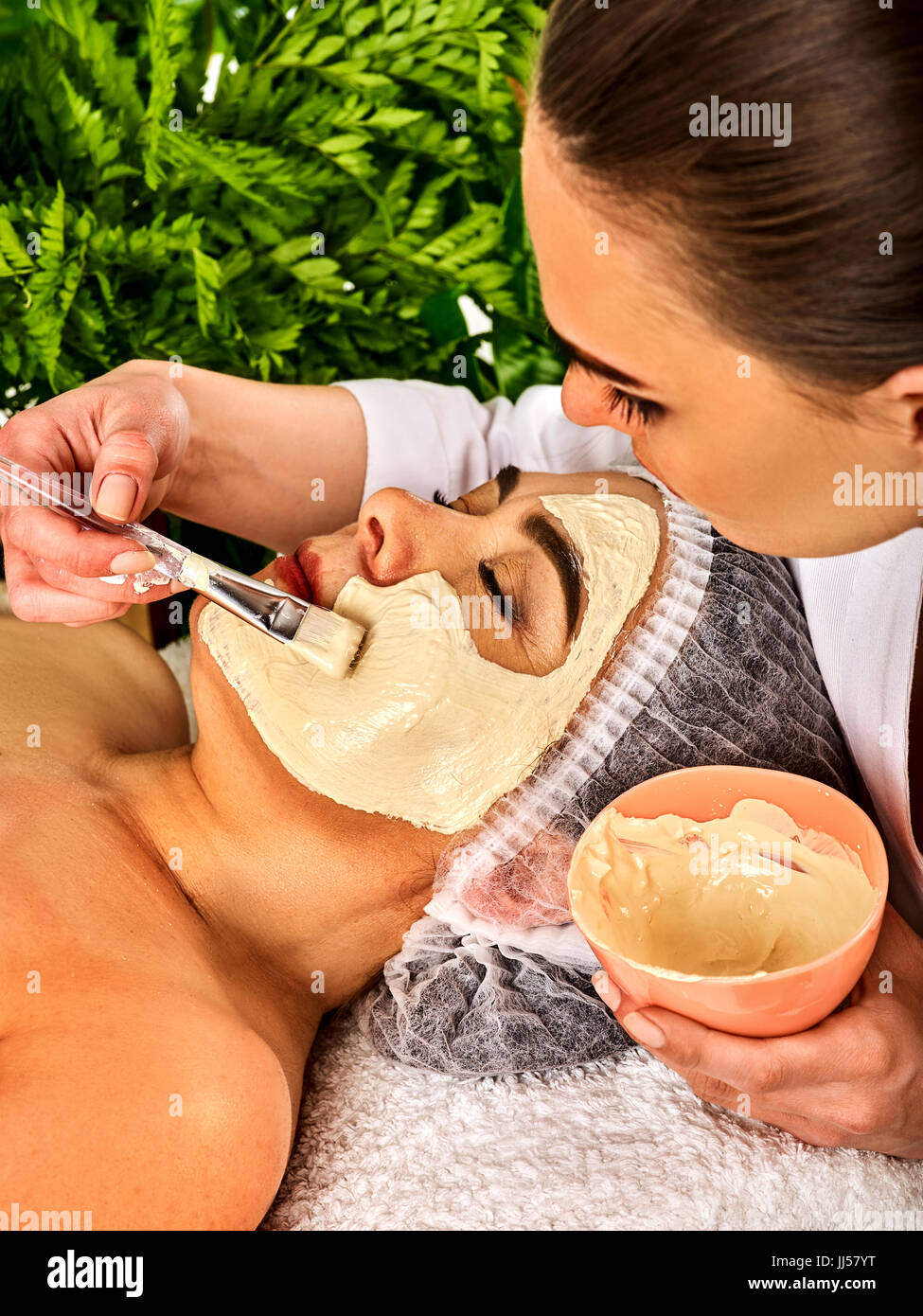 Collagen face mask . Facial skin treatment. Woman receiving cosmetic procedure. Stock Photo