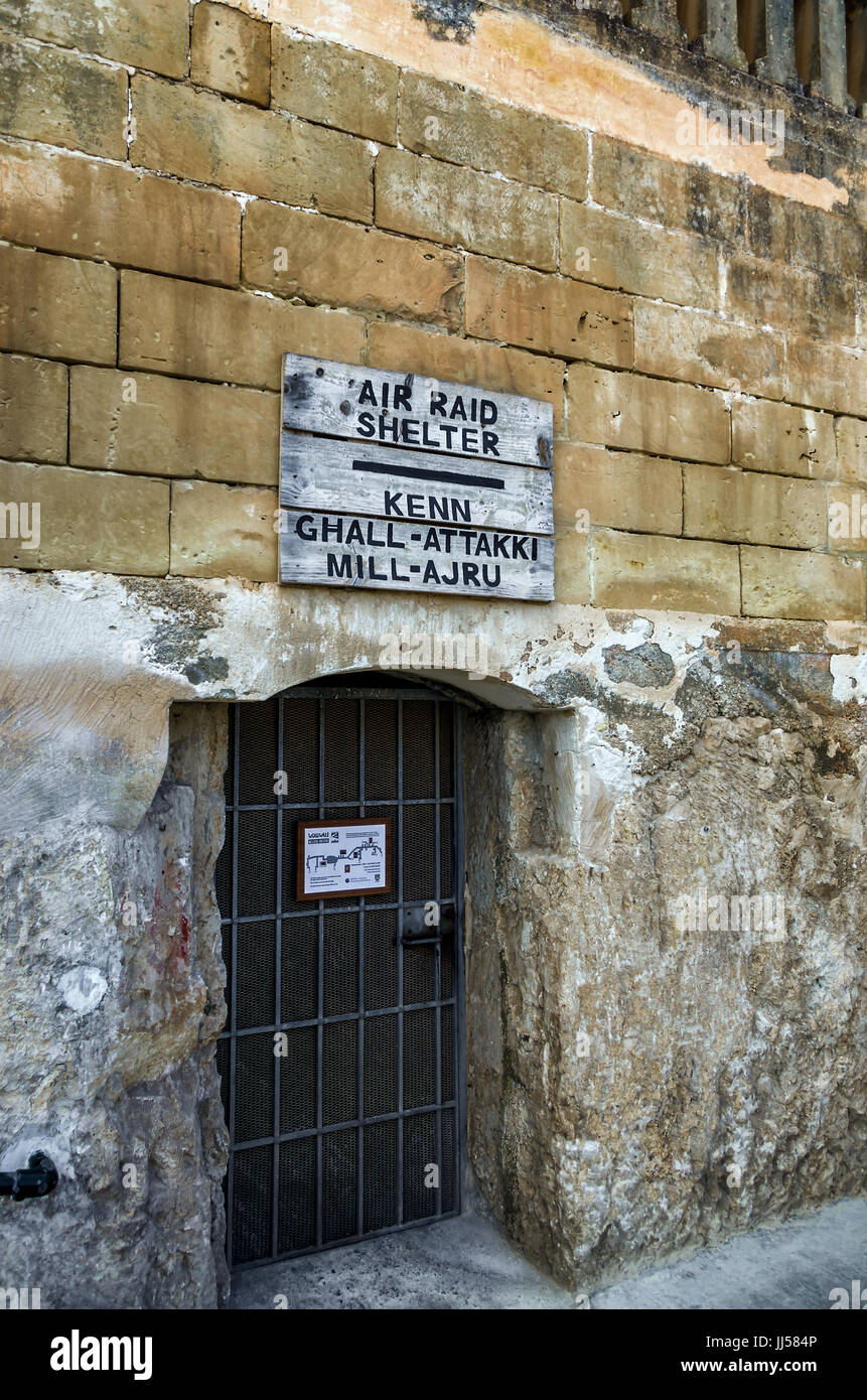 Signboards above the entrance to air raid shelters - Mellieha, Malta. Stock Photo