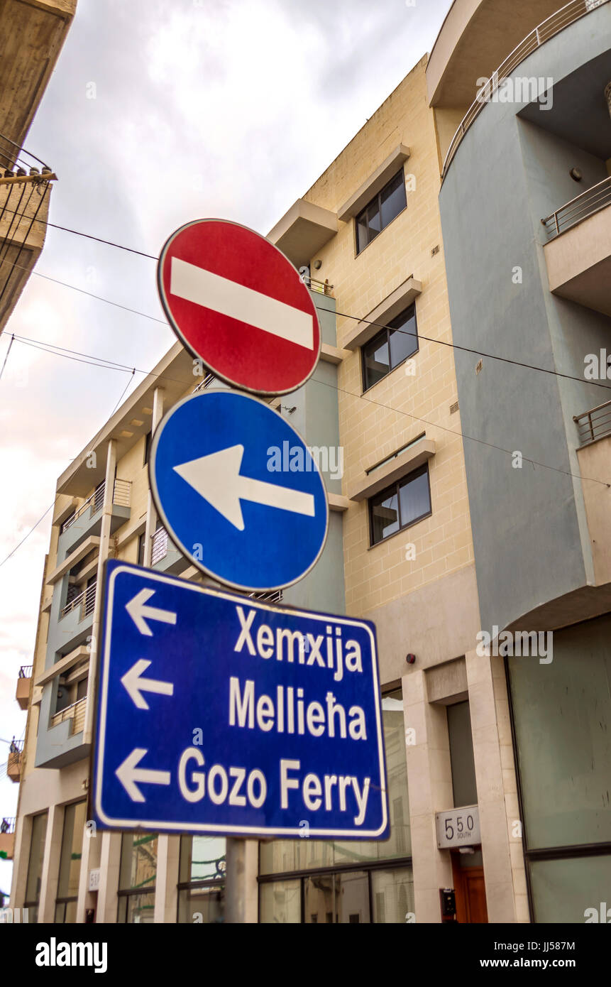 Malta, St Paul’s Bay Traffic signs and blue road sign showing the way