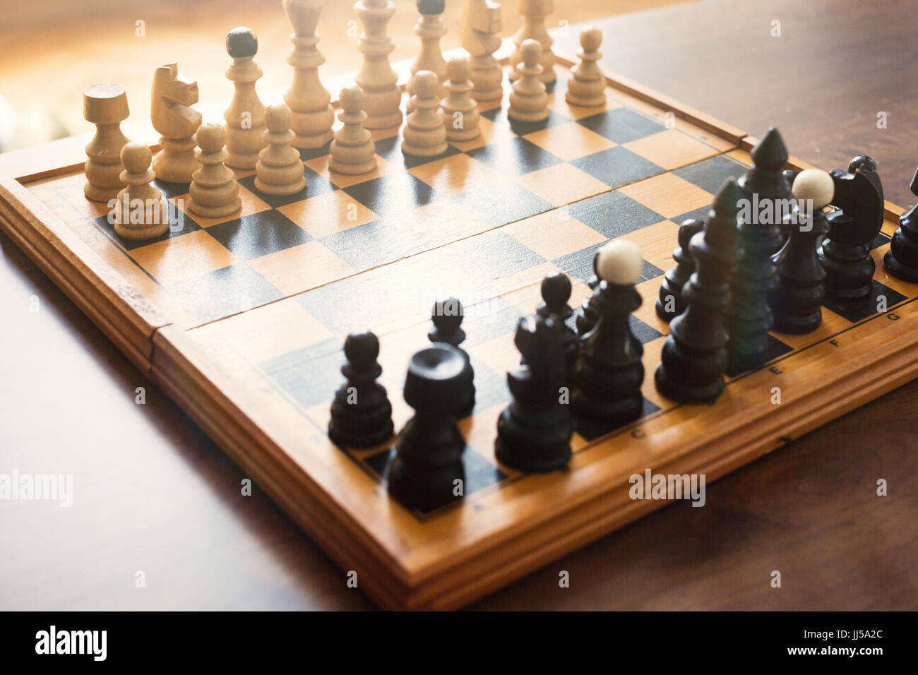 Chess board with chess wooden pieces isolated on white Stock Photo Alamy