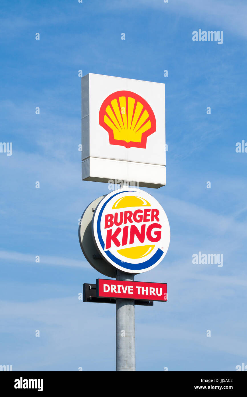 Warsaw, Poland - July 08, 2017: Shell and Burger King pylon on blue sky background near the highway. Stock Photo