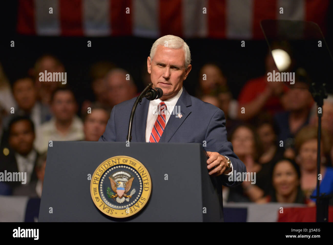 U.S. President Donald Trump delivers remarks to a crowd of people and ...
