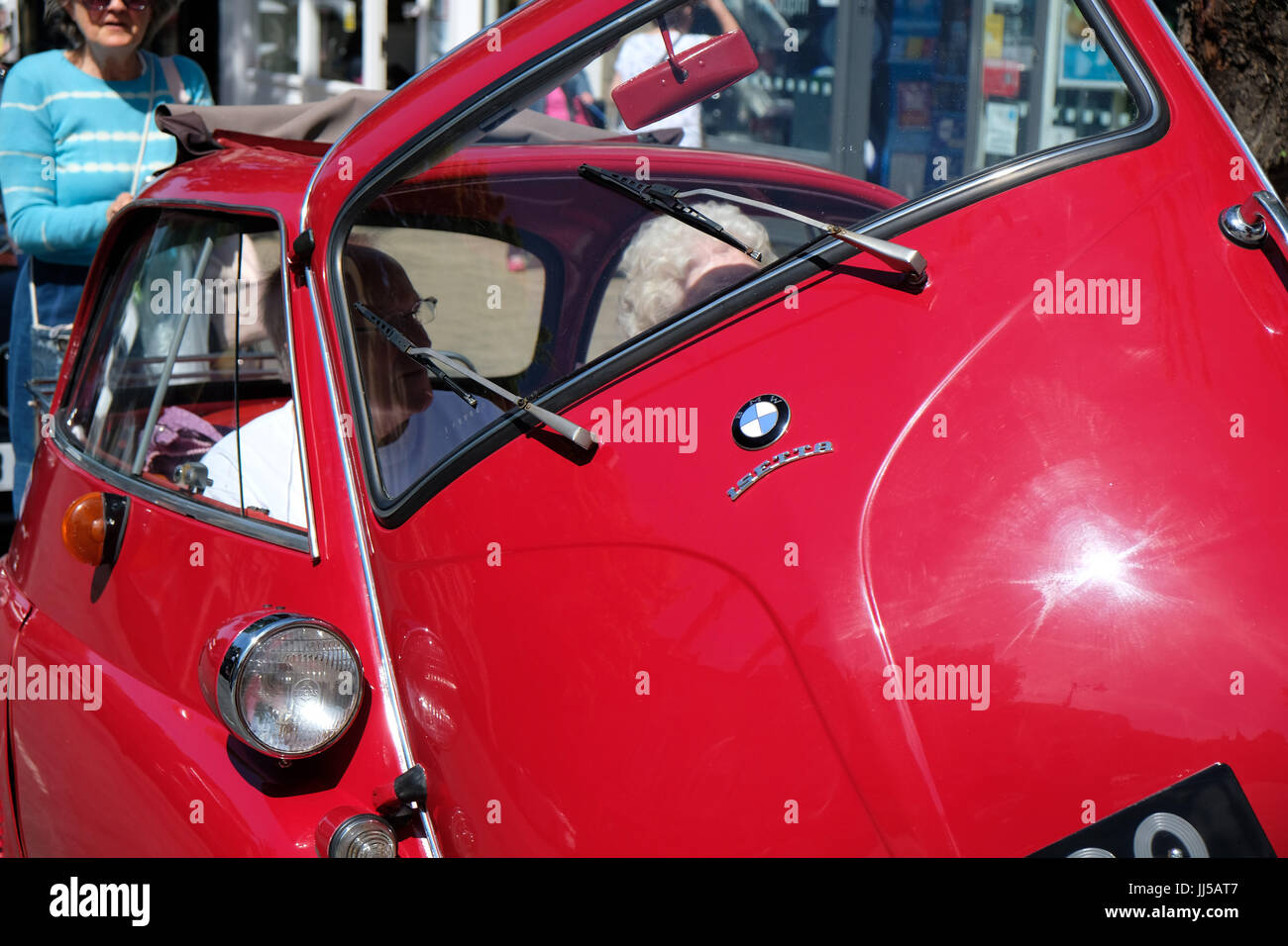 BMW Isetta draws a crowd when parked in street in Yorkshire Stock Photo