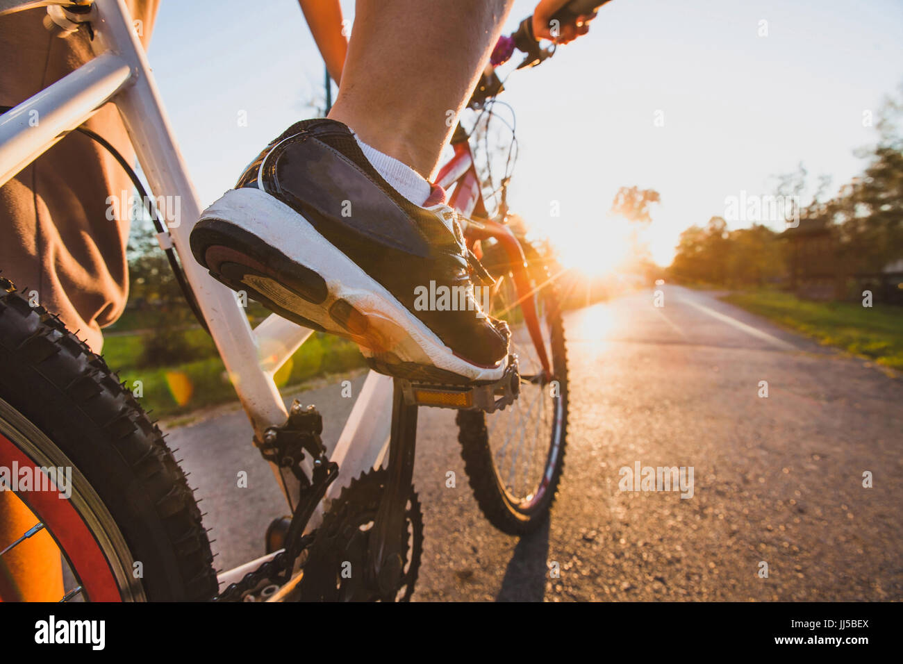 cycling outdoors, close up of the feet on pedal Stock Photo