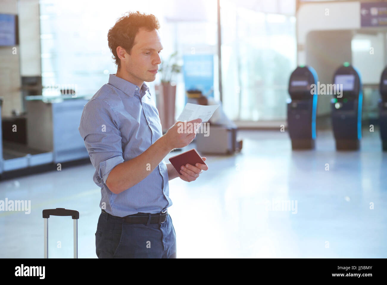 man checking boarding pass and number of gate in the airport Stock Photo