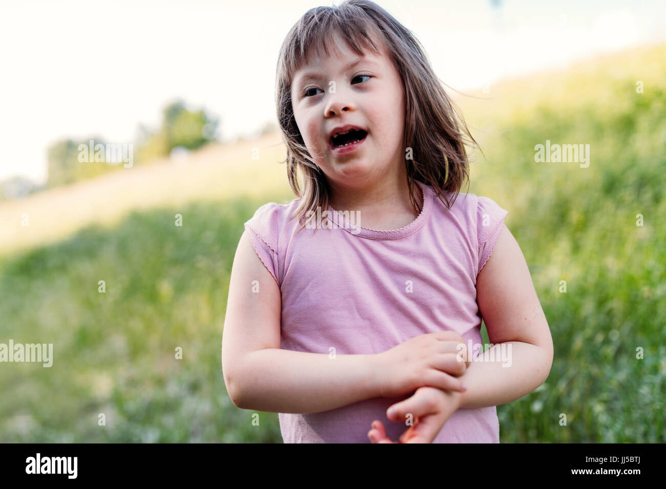 Portrait of young girl with down syndrome Stock Photo
