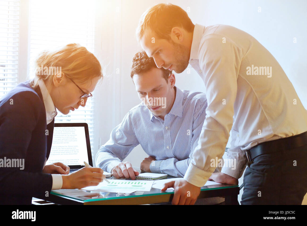 brainstorming, teamwork concept, business team working on a project, busy caucasian people in the office Stock Photo
