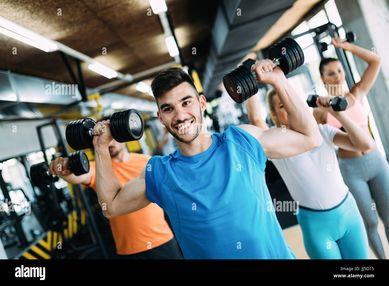 Group of people training together in gym Stock Photo