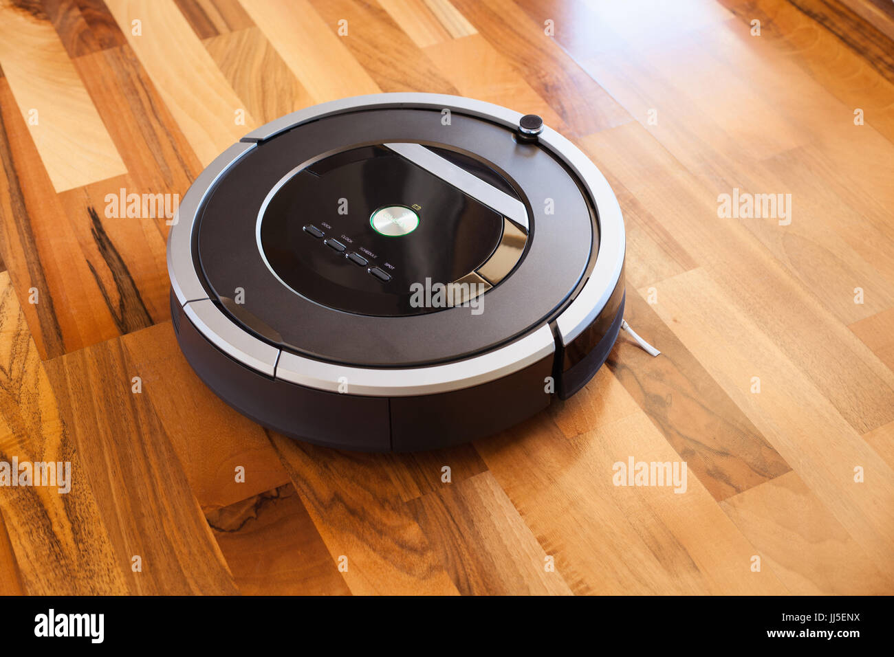 robotic vacuum cleaner on laminate wood floor smart cleaning technology Stock Photo Alamy