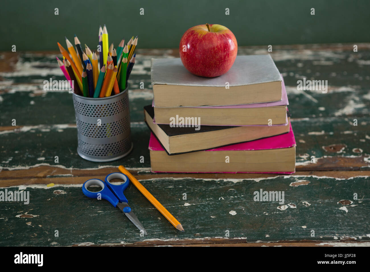Book Stack With Ruler Apple Close-up of apple on book stack with various stationery Stock Photo - Alamy