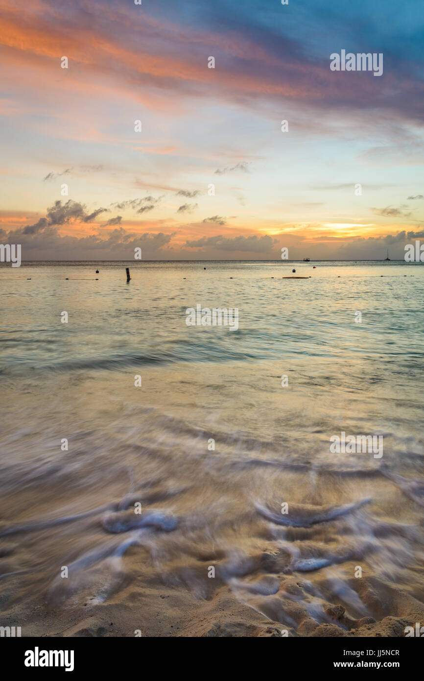 Retreating tide on Seven Mile Beach in Grand Cayman. Stock Photo