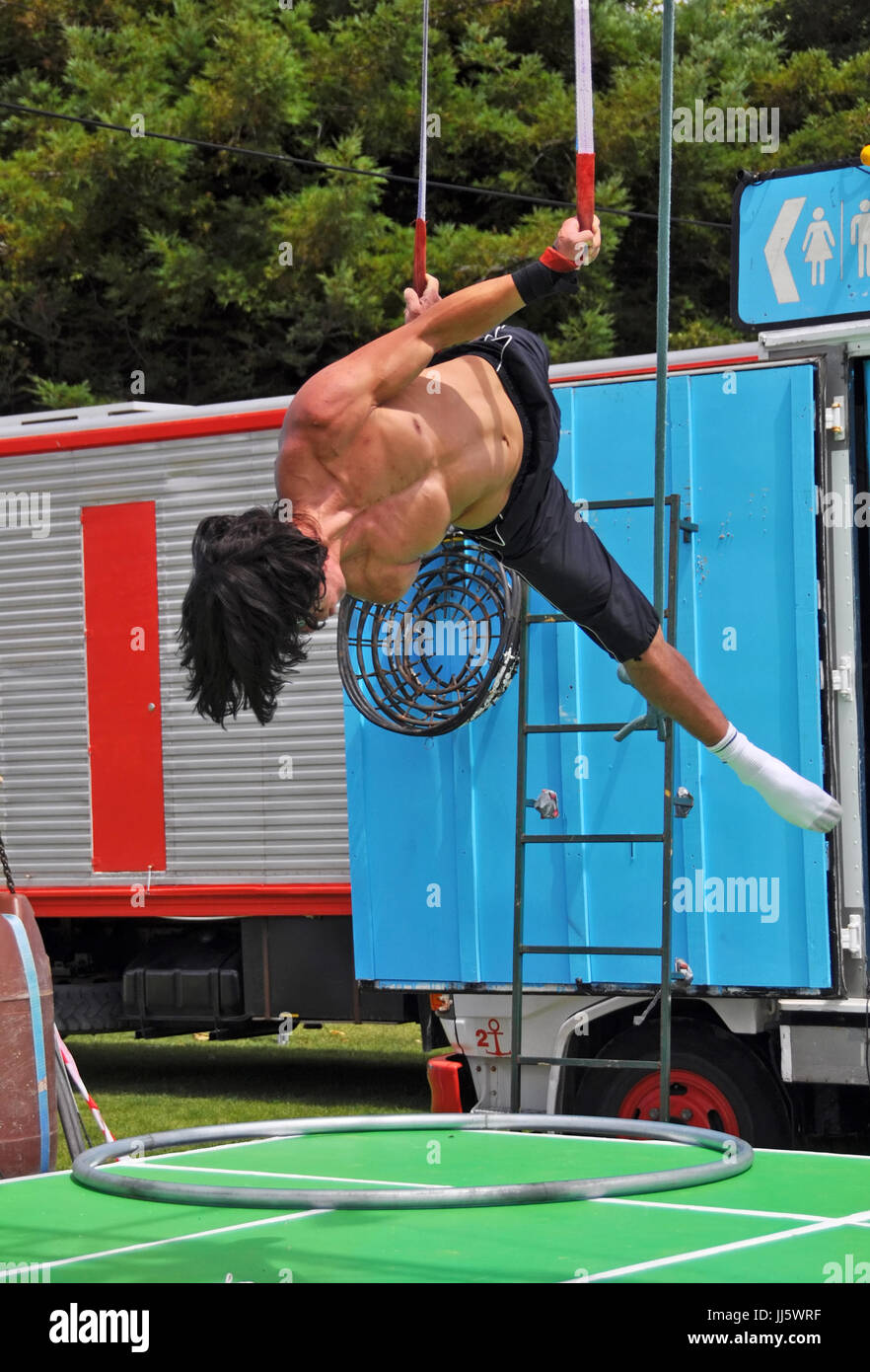 Christchurch, New Zealand - January 21, 2013: Fuse Circus performer practicing before the Campground Chaos show at the 20th World Buskers Festival on  Stock Photo