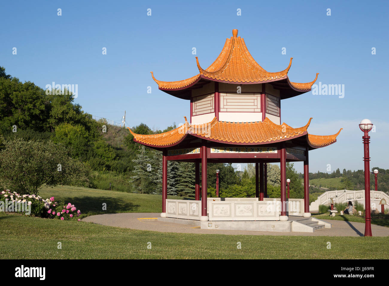 Chinese Garden pavilion at Louise McKinney Park in spring with clear blue sky, Edmonton river valley, Alberta, Canada Stock Photo