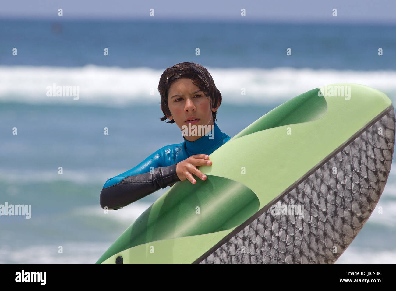 Young surfer boy and surfboard Stock Photo Alamy
