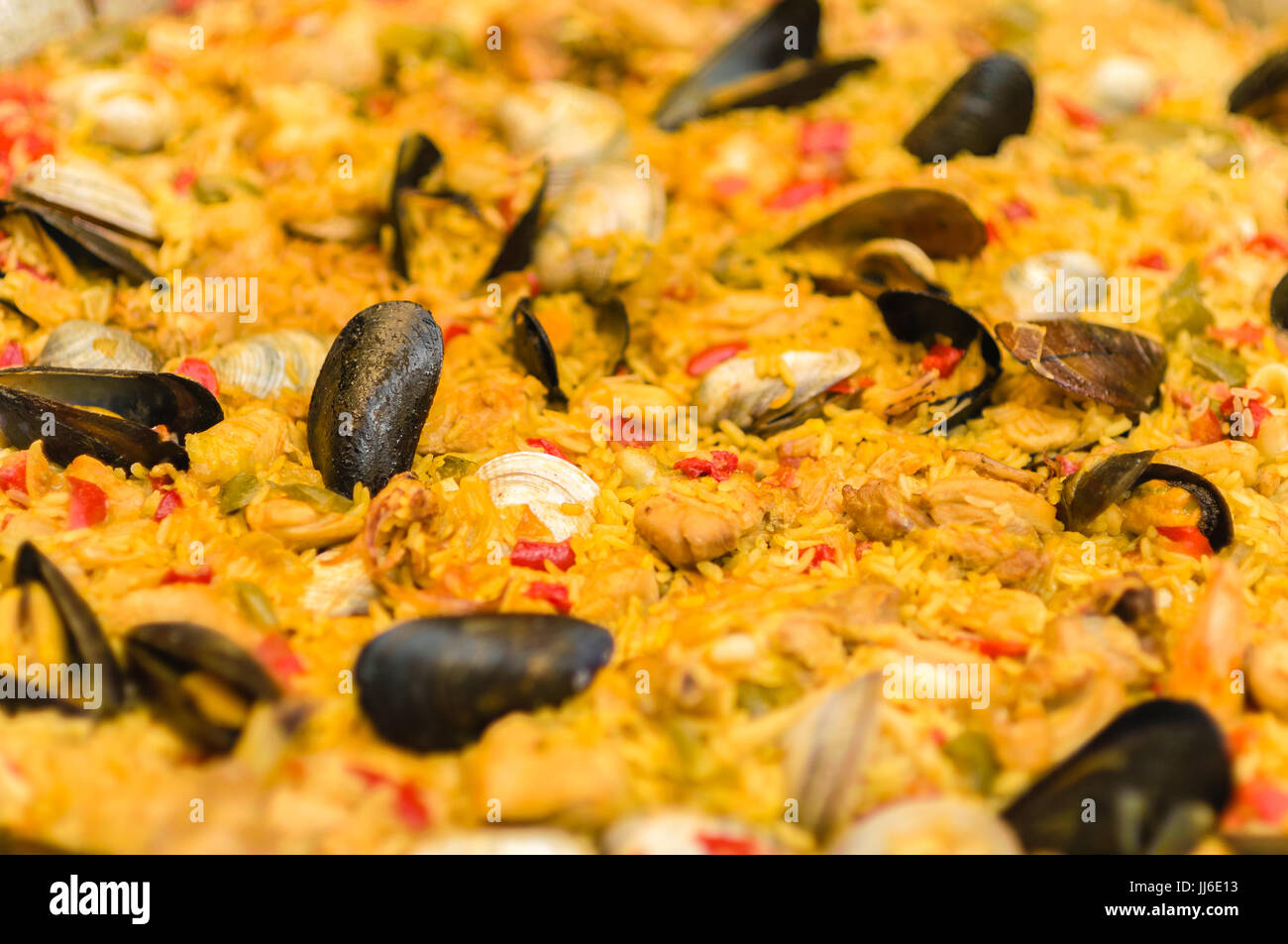 Paella valenciana, rice with saffron and seafood Stock Photo
